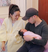 tiffany and husband with baby