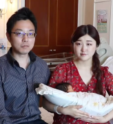 mr and mrs wakuta with their baby