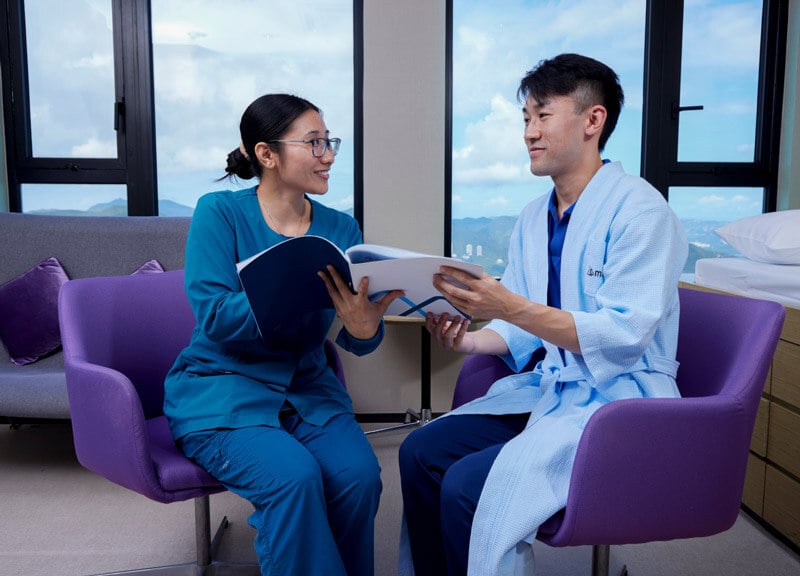 doctor talking to male patient