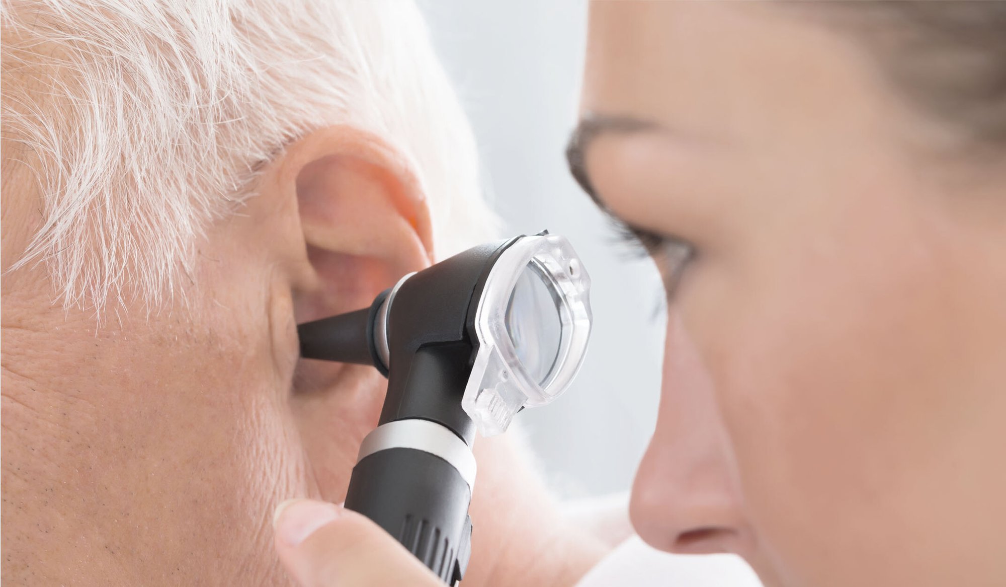 patient undergoing ear exam