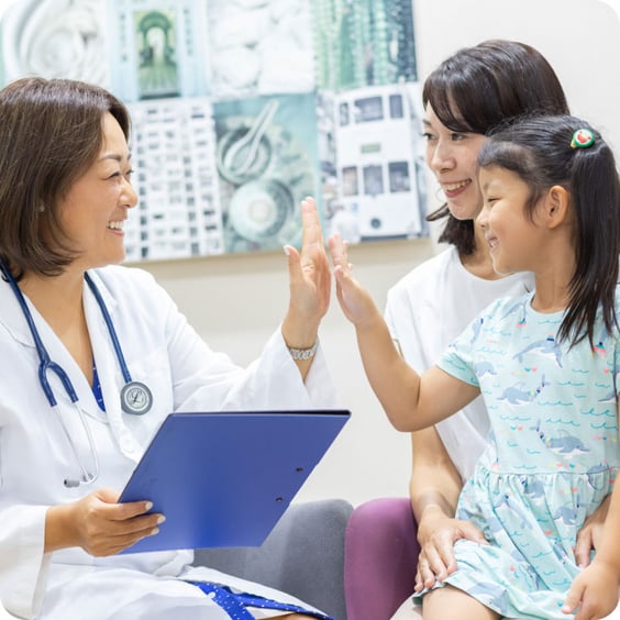 doctor high fiving child